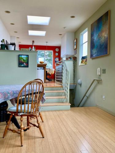 a living room with a chair and a staircase at San Francisco Potrero Hill Nest in San Francisco