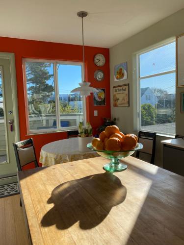 a kitchen with a table with a bowl of oranges on it at San Francisco Potrero Hill Nest in San Francisco
