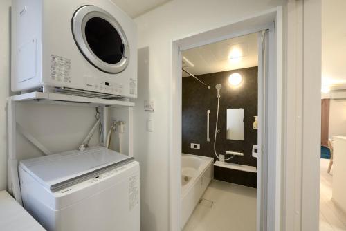Ένα μπάνιο στο Nuji House UK Tomigusuku