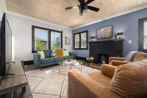 a living room with a couch and a fireplace at Walk to State Street - Remodeled Home in Bristol