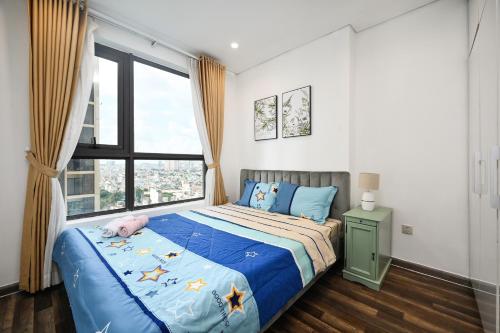 Ένα ή περισσότερα κρεβάτια σε δωμάτιο στο Hà Đô Q10 2PN-3PN 2WC- Khoa Home