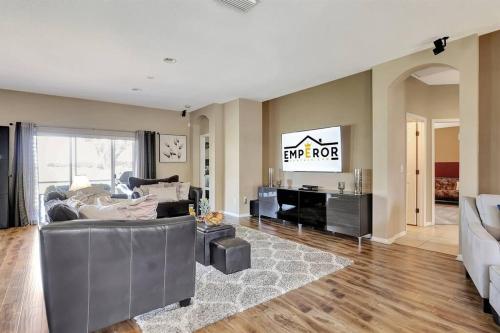 a living room with a couch and a tv at Golf Course Community! Amazing Home for 8 Guests in Valrico