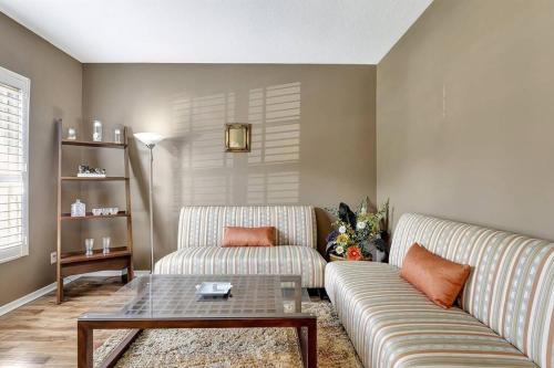 a living room with a couch and a coffee table at Golf Course Community! Amazing Home for 8 Guests in Valrico