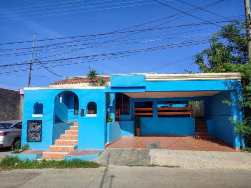 a blue house with stairs in front of it at Casa Alux Azul in Valladolid
