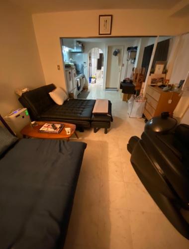 a living room with a couch and a table at Azabujuban Properties 401 - the sanctuary in Tokyo