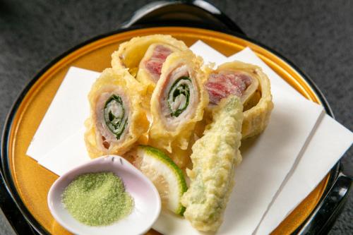 a plate of food with a sandwich and a sauce at Tennomaru in Gamagori