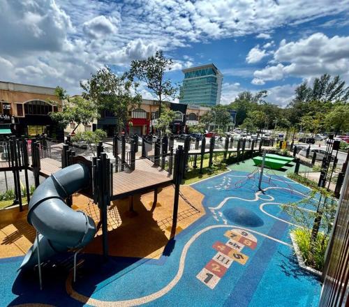 a playground with a water slide in a park at 75's Urban Escape, Seksyen 13, Shah Alam in Shah Alam