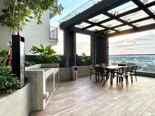 a patio with a table and chairs on a building at 75's Urban Escape, Seksyen 13, Shah Alam in Shah Alam