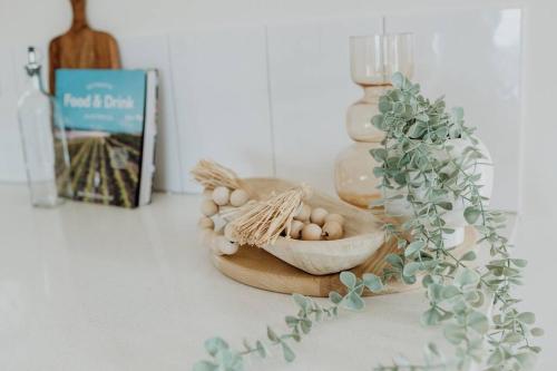 a table with a bowl of eggs and a plant at Acreage property, pet friendly, outdoor campfire in Bald Knob