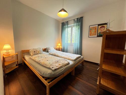 Postel nebo postele na pokoji v ubytování Paradiso in verzasca Motta