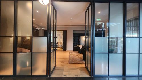 a hallway with glass doors in a building at Marsden Viaduct in Auckland