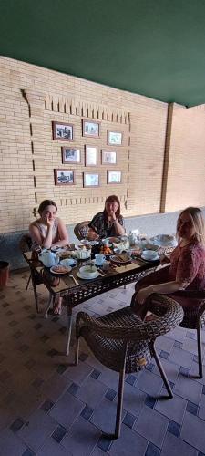 a group of people sitting at a table at HOTEL MEHRIBON in Samarkand
