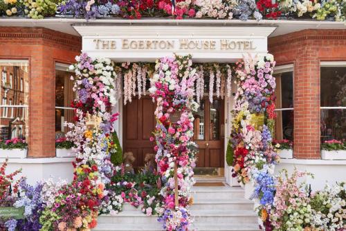 a building with a bunch of flowers on it at Egerton House in London
