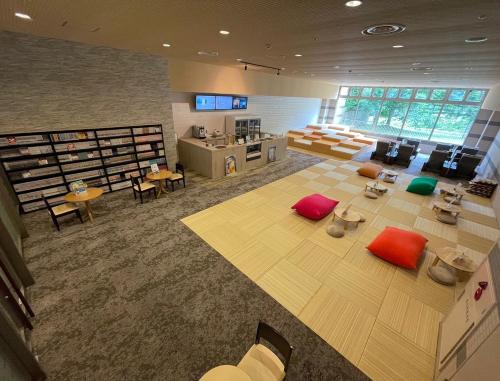 an overhead view of a large room with a library at LiVEMAX RESORT Hakodate Greenpia Onuma in Mori