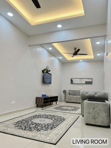 a living room with couches and a ceiling at SFS Family Homestay Kulim in Kulim