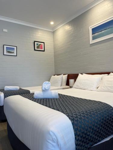 Ένα ή περισσότερα κρεβάτια σε δωμάτιο στο Bayview Motel