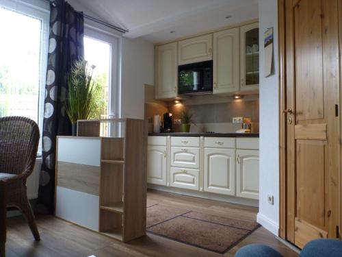 Η κουζίνα ή μικρή κουζίνα στο Ferienhaus Holst Sylt