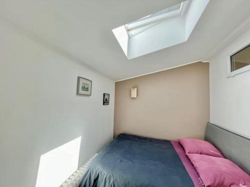 a bedroom with a bed and a window at 3 bedrooms house - garden - Parking, Antony Center near Paris and Orly in Antony