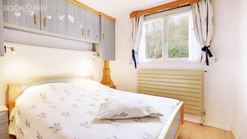 Voodi või voodid majutusasutuse Le Chalet Sous Les Sapins toas