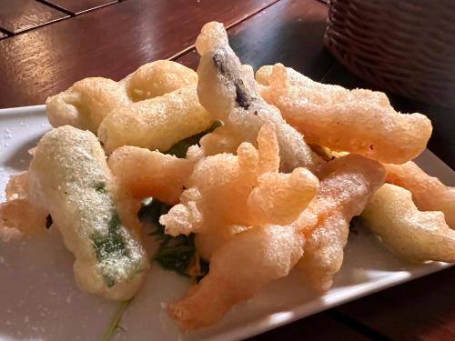 a plate of food with shrimp on a table at Hotel Ortensia in Ponza