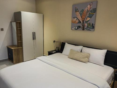 Ένα ή περισσότερα κρεβάτια σε δωμάτιο στο THE SIGNATURE HOTEL Apartment