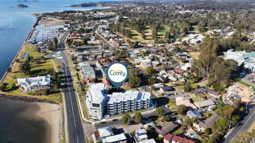 an aerial view of a city with a hot air balloon at Elegant 2-Bed Apartment with Stunning Views in Batemans Bay