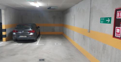 a parking garage with a car parked in it at Apartman Elena Ekolu in Split