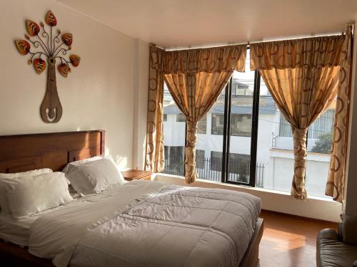 Postel nebo postele na pokoji v ubytování Loreto hotel