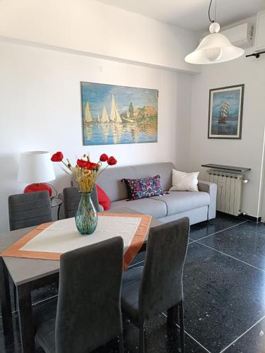 a living room with a table and a couch at B&B Casa Scotto in Savona