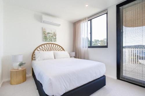 Ένα ή περισσότερα κρεβάτια σε δωμάτιο στο Bay View 2-Bedroom Apartment with BBQ
