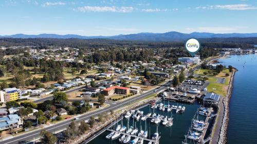 an aerial view of a marina with a hot air balloon at Oceanside Apartment with Bay Views in Batemans Bay