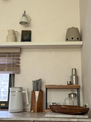 a kitchen counter with a bowl on top of it at IVIS House Lakeside Retreat in Vilnius in Vilnius