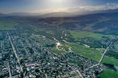an aerial view of a city and a river at Mountain View in Kochkor