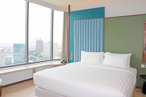 Cama o camas de una habitación en The Quarter Ratchayothin by UHG