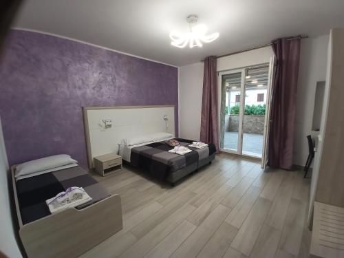 Postel nebo postele na pokoji v ubytování La Dea Rooms