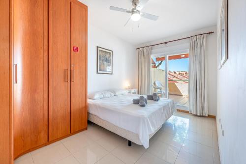 a bedroom with a bed and a large window at Beautiful 2 Bed Apartment Los Pacos in Las Lagunas Mijas