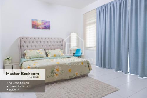 a bedroom with a bed with blue curtains at Rania Homestay KLIA by Xpresso Home in Sepang