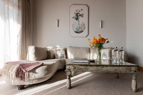 a living room with a couch and a coffee table at Zhiwaling Heritage in Paro