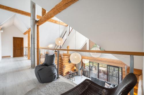 a living room with a couch and a fireplace at Chalet Piros Tale - Sauna - Jacuzzi - Beautiful scenery - Kids playground - In the forest in Tale
