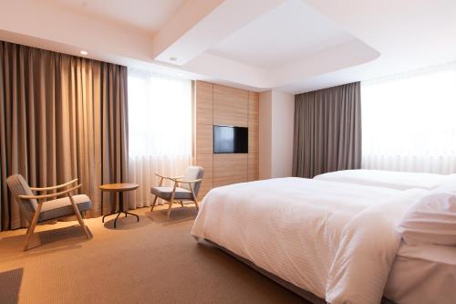 Postel nebo postele na pokoji v ubytování Acube Hotel Dongdaemun