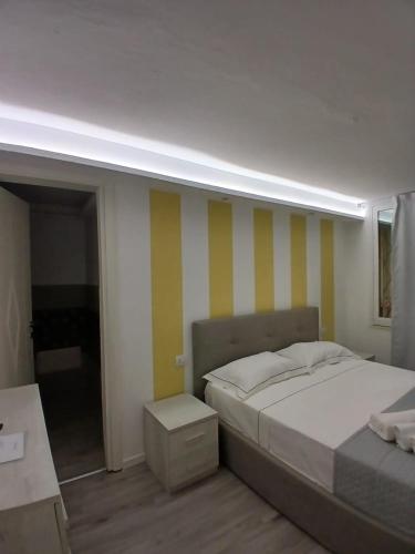 Ένα ή περισσότερα κρεβάτια σε δωμάτιο στο Residenza Aura