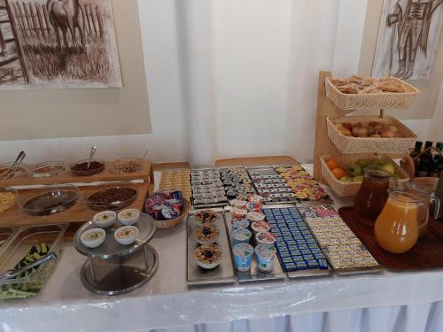 a table with a bunch of different types of pastries at Hotel Gold in Terchová