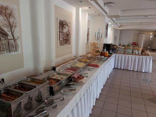 a buffet line with food on it in a room at Hotel Gold in Terchová