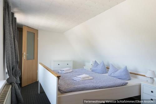 Postel nebo postele na pokoji v ubytování Ferienwohnung in Bodden & Ostsee nähe