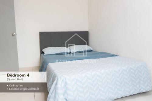 a bed with two white pillows on top of it at Rania Homestay KLIA by Xpresso Home in Sepang