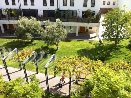 a woman and child walking through a park at Lisbon Blue - Metro at your Door in Lisbon