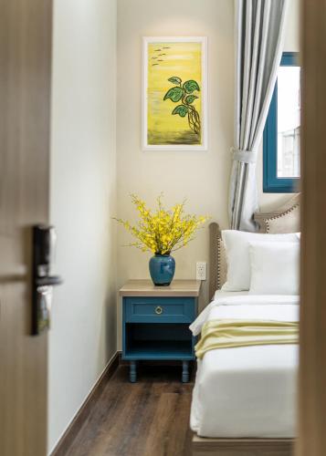 Postel nebo postele na pokoji v ubytování Jan Villa SaiGon Oasis
