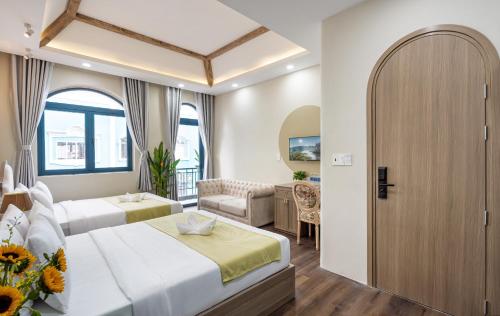 Postel nebo postele na pokoji v ubytování Jan Villa SaiGon Oasis