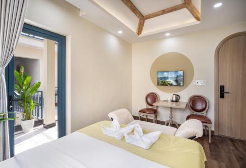 Postel nebo postele na pokoji v ubytování Jan Villa SaiGon Oasis