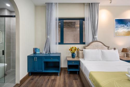 Postel nebo postele na pokoji v ubytování Jan Villa SaiGon Oasis